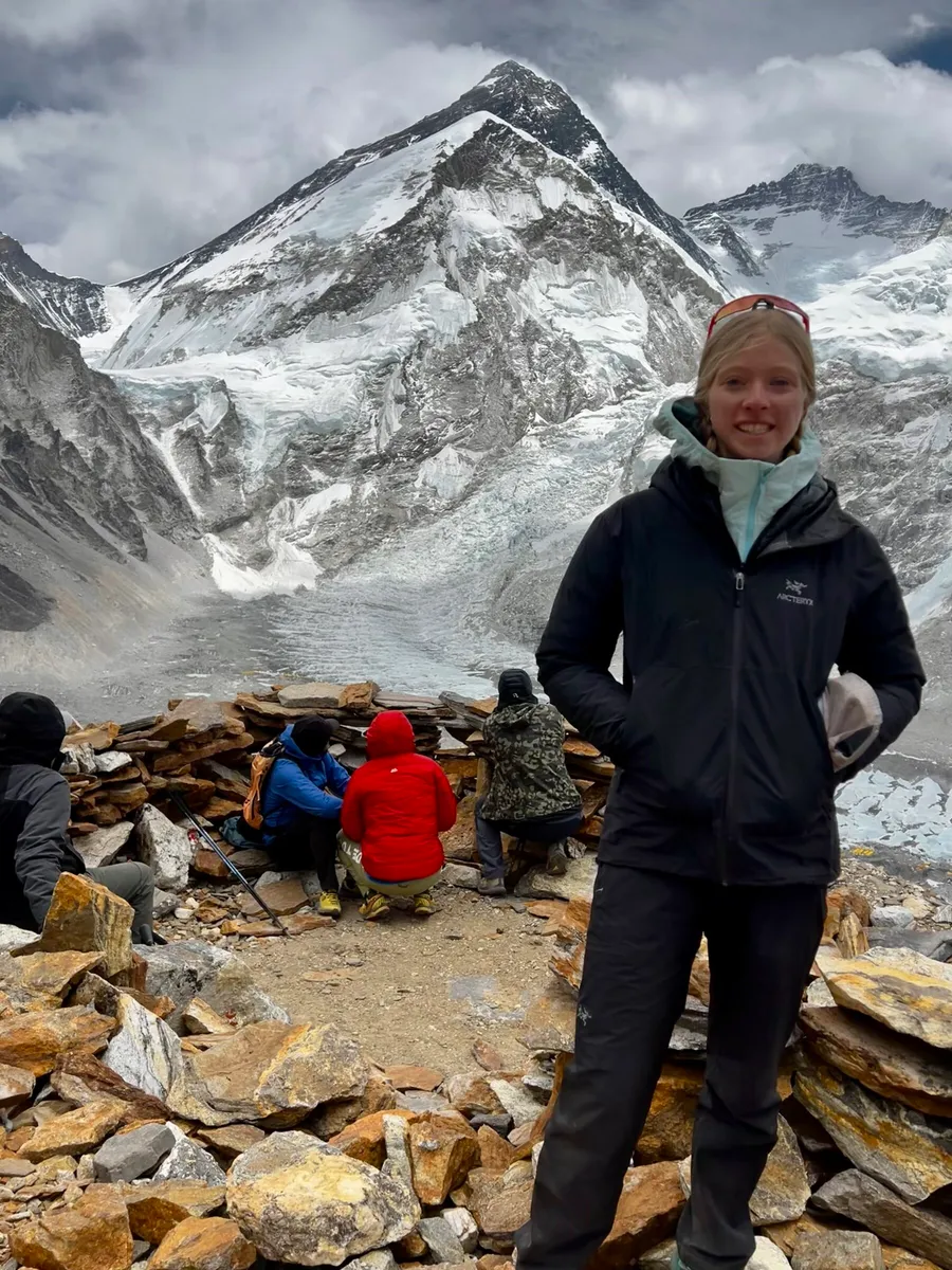 Bianca at Everest Base Camp with Everest behind her
